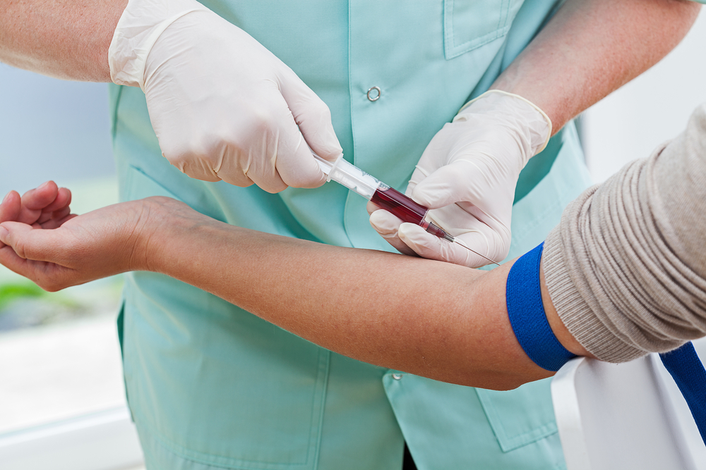 Nurse collecting a blood from a patient-1